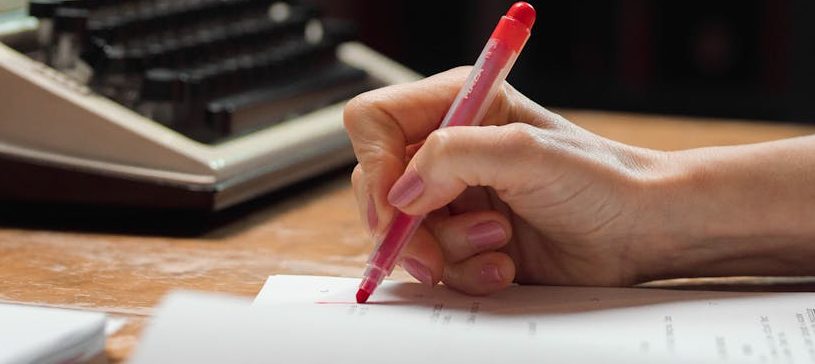 a person checking a composition