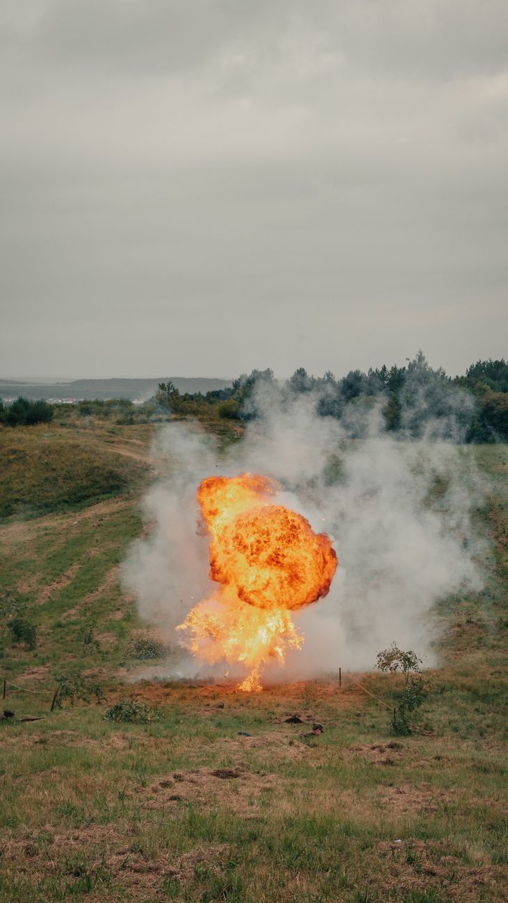 dramatic explosion in open field landscape